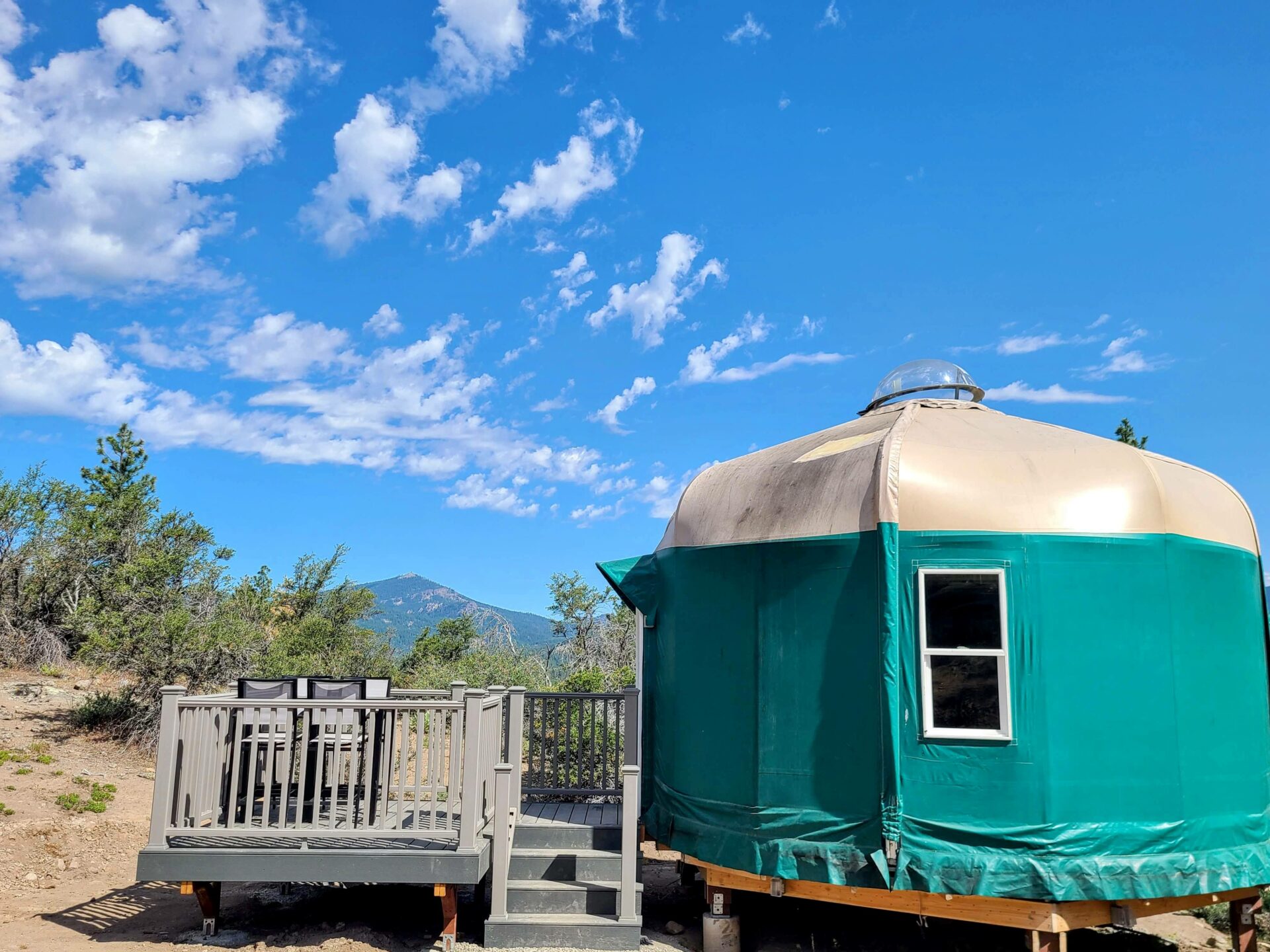Cabin interior with queen bunk beds and kitchen